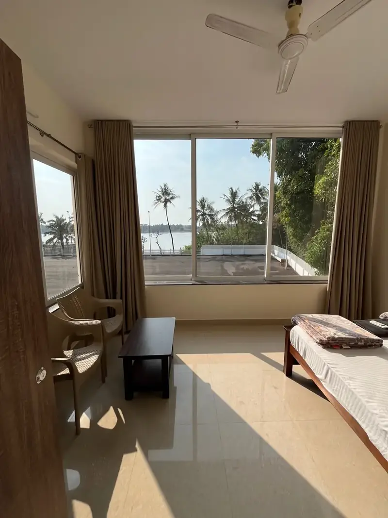 Room 104 River View – room with kitchen and fridge at Francis Doris Skate City Mangaluru